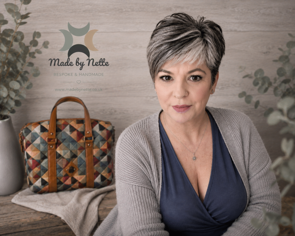 Nette, the maker behind Made by Nette, pictured with a handmade Mosaic Hobo Tote