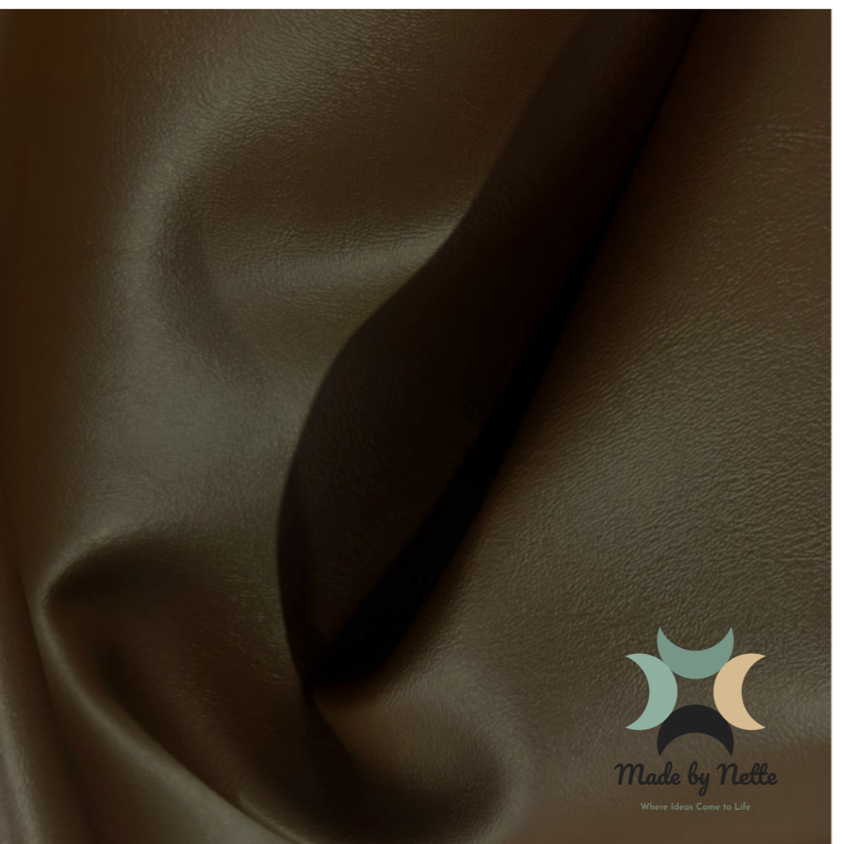 Smooth chocolate brown faux leather, perfect for creating warm, versatile bag designs.