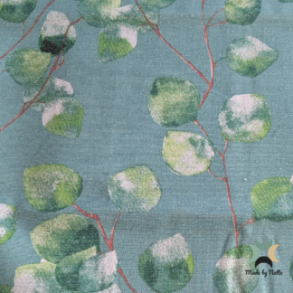 A teal canvas featuring a botanical eucalyptus leaf print in shades of green and pale pink.