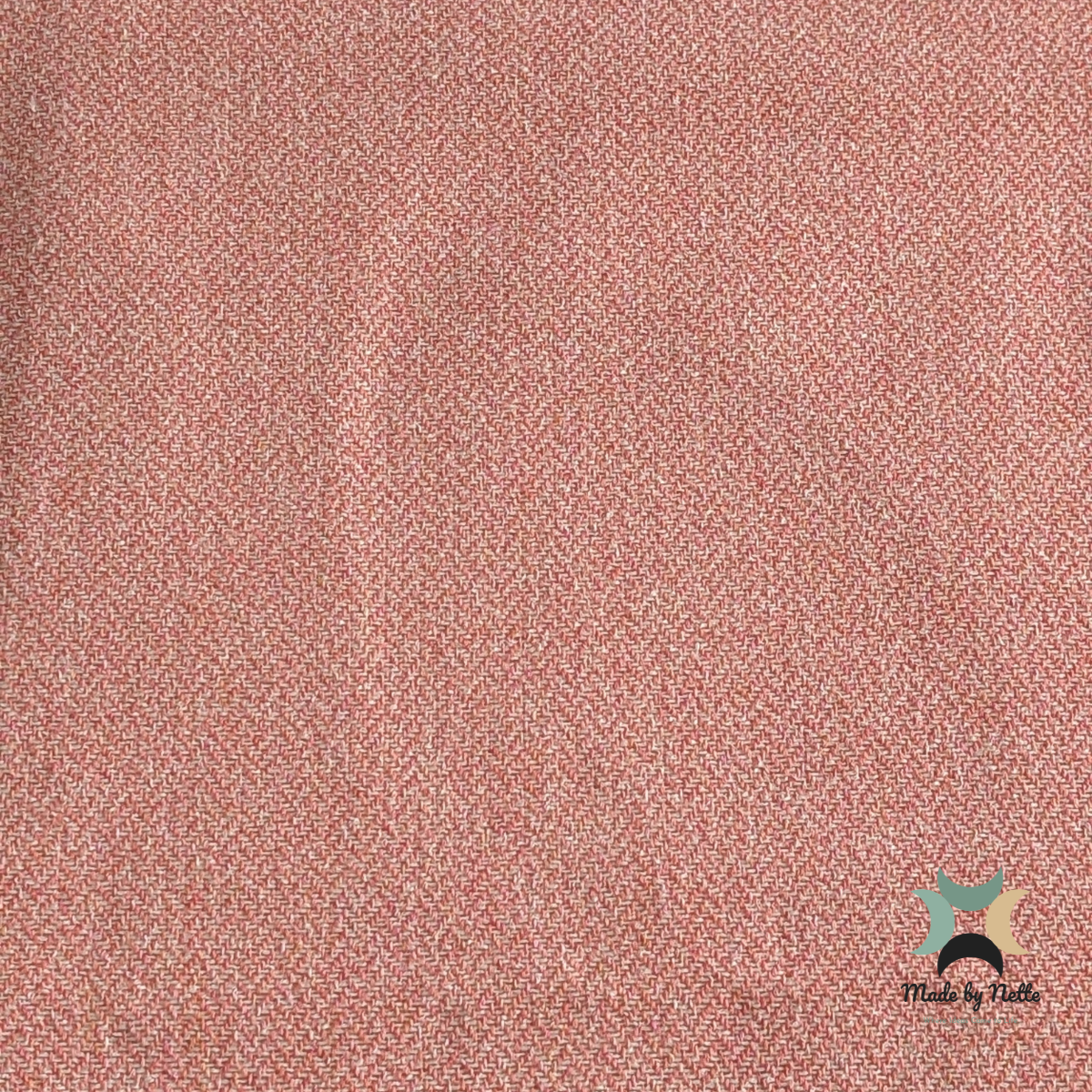 A textured Orkney Tweed Style fabric in a soft blossom-pink shade.