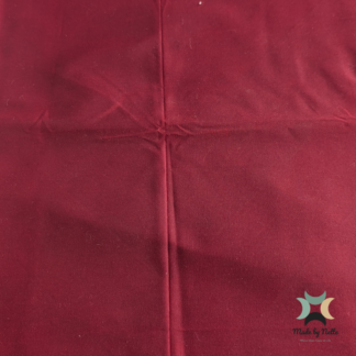 A Bordeaux-coloured waxed canvas in a rich, deep red tone.