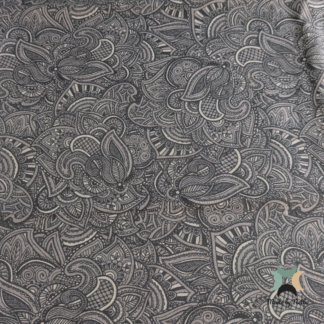 A patterned cotton fabric featuring a grey paisley design for a classic, decorative finish.