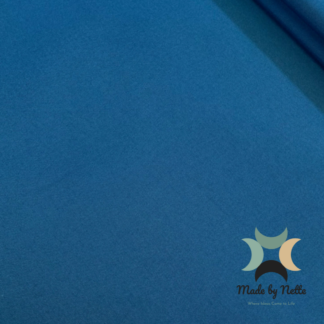 Blue water-resistant upholstery fabric offering a versatile colour for handmade bags.