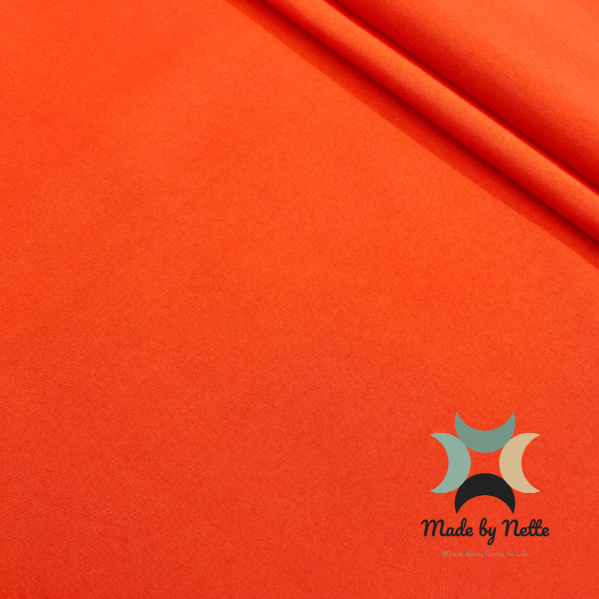 Vibrant orange water-resistant upholstery fabric for a bold and colourful handmade bag.